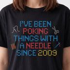 "I've been poking things with a needle since [Year]" Faux Cross Stitch T-Shirt | Custom Year