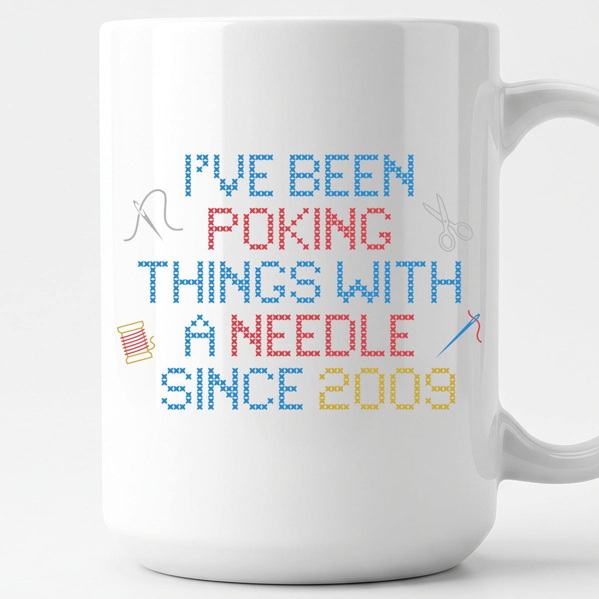 "I've been poking things with a needle since [Year]" Faux Cross Stitch Coffee Cup | Custom Year