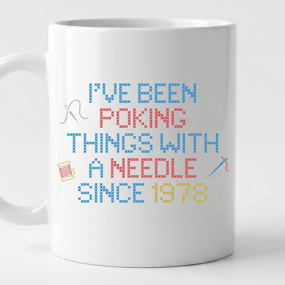 "I've been poking things with a needle since [Year]" Faux Cross Stitch Coffee Cup | Custom Year