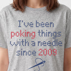 "I've been poking things with a needle since [Year]" Custom Faux Cross Stitch T-Shirt | Custom Year Tee