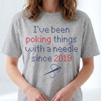 "I've been poking things with a needle since [Year]" Custom Faux Cross Stitch T-Shirt | Custom Year Tee