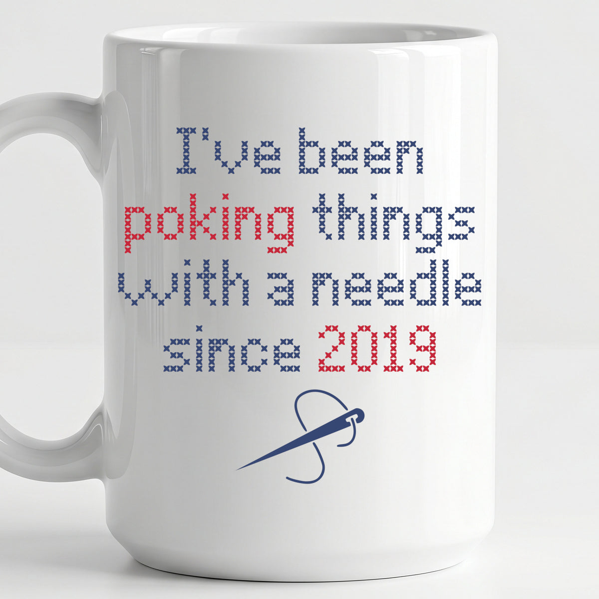 "I've been poking things with a needle since [Year]" Faux Cross Stitch Coffee Cup | Custom Year Mug