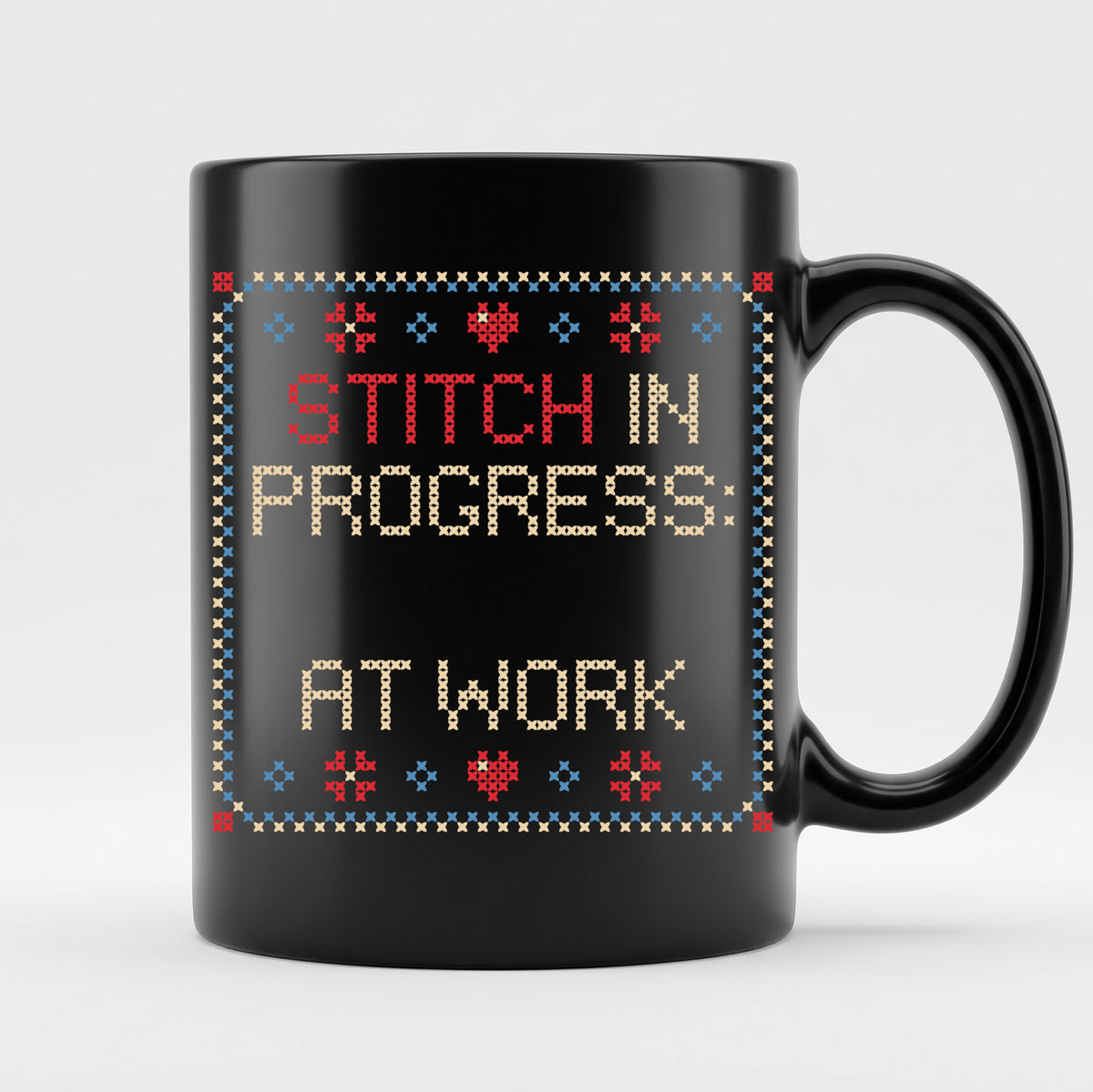 "Stitch in progress: [Name] at work" - Faux Cross Stitch Coffee Cup | Custom Name Mug