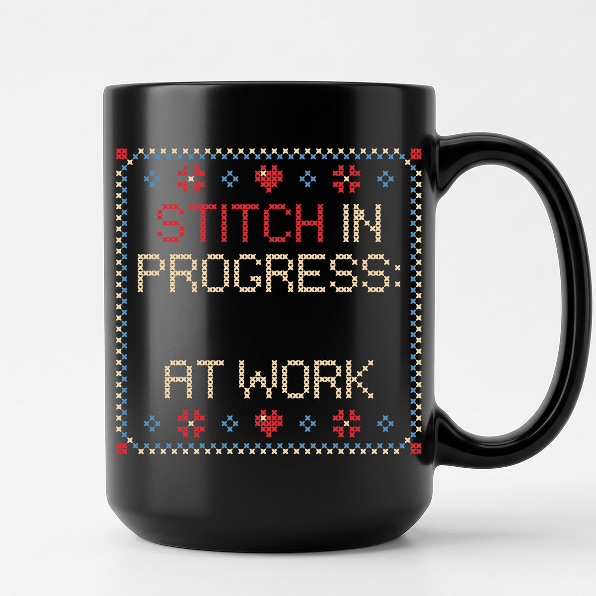 "Stitch in progress: [Name] at work" - Faux Cross Stitch Coffee Cup | Custom Name Mug