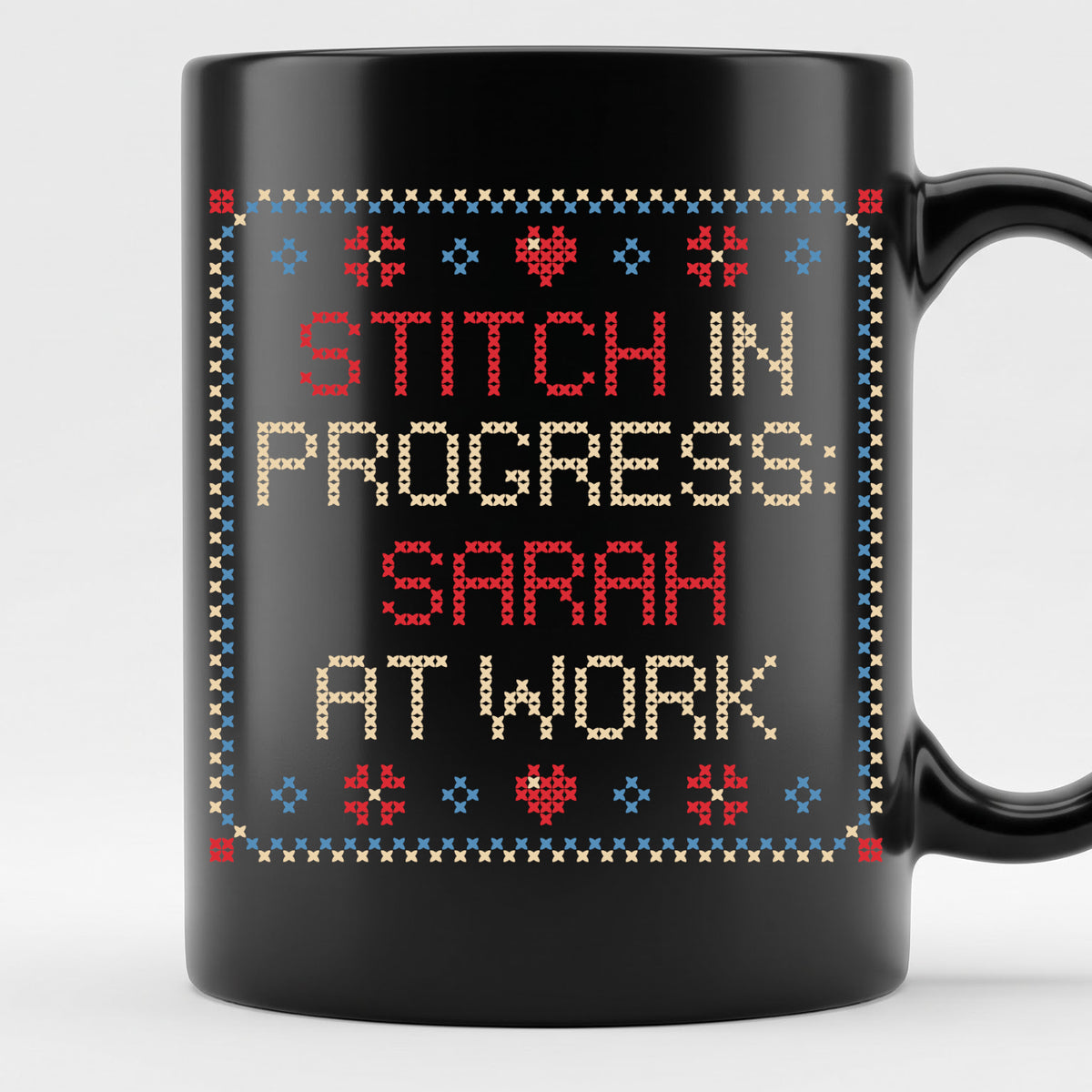 "Stitch in progress: [Name] at work" - Faux Cross Stitch Coffee Cup | Custom Name Mug
