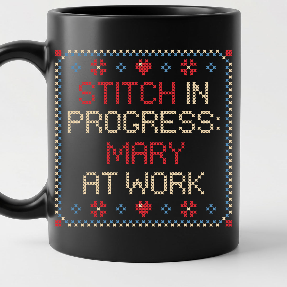 "Stitch in progress: [Name] at work" - Faux Cross Stitch Coffee Cup | Custom Name Mug