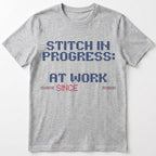 "Stitch in progress: [Name] at work. Since [Year]" - Faux Cross Stitch T-Shirt | Personalized Gift