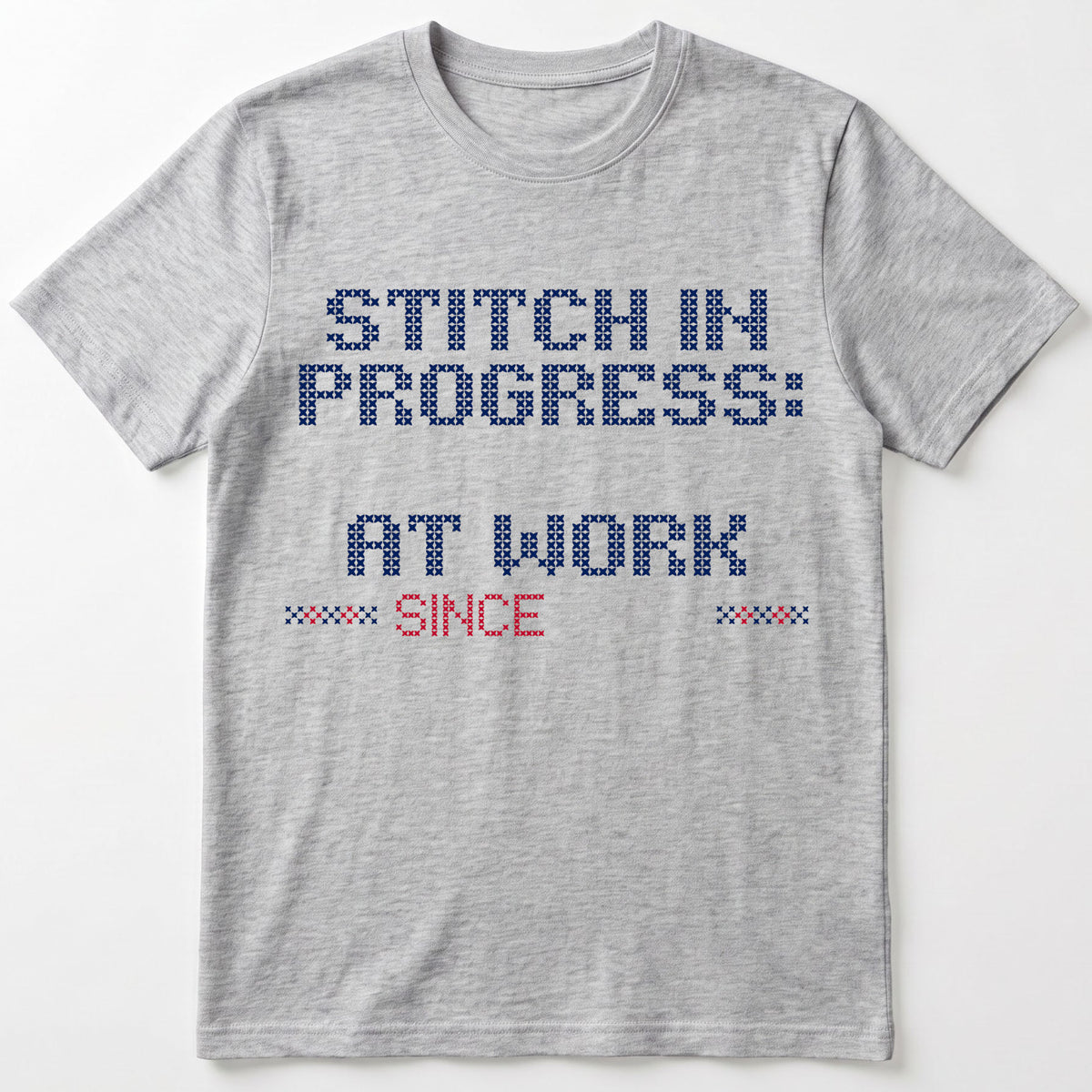 "Stitch in progress: [Name] at work. Since [Year]" - Faux Cross Stitch T-Shirt | Personalized Gift