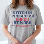"Stitch in progress: [Name] at work. Since [Year]" - Faux Cross Stitch T-Shirt | Personalized Gift