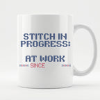 "Stitch in progress: [Name] at work. Since [Year]" - Faux Cross Stitch Mug | Personalized Gift