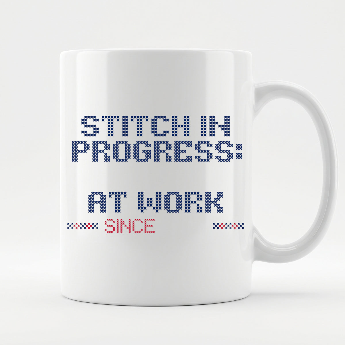 "Stitch in progress: [Name] at work. Since [Year]" - Faux Cross Stitch Mug | Personalized Gift