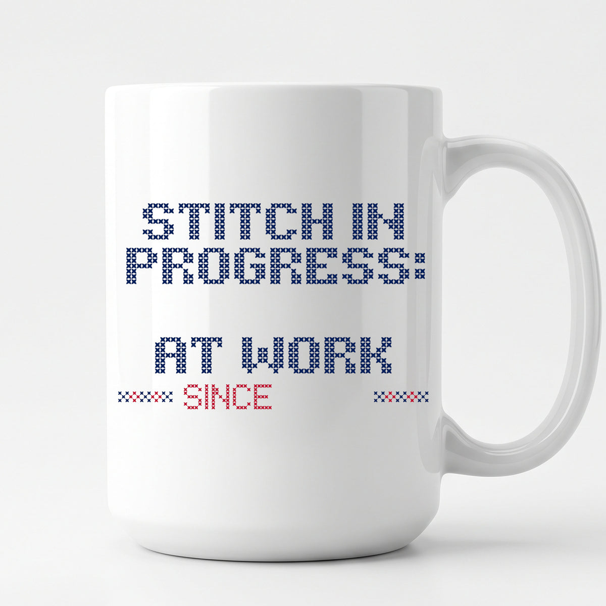 "Stitch in progress: [Name] at work. Since [Year]" - Faux Cross Stitch Mug | Personalized Gift