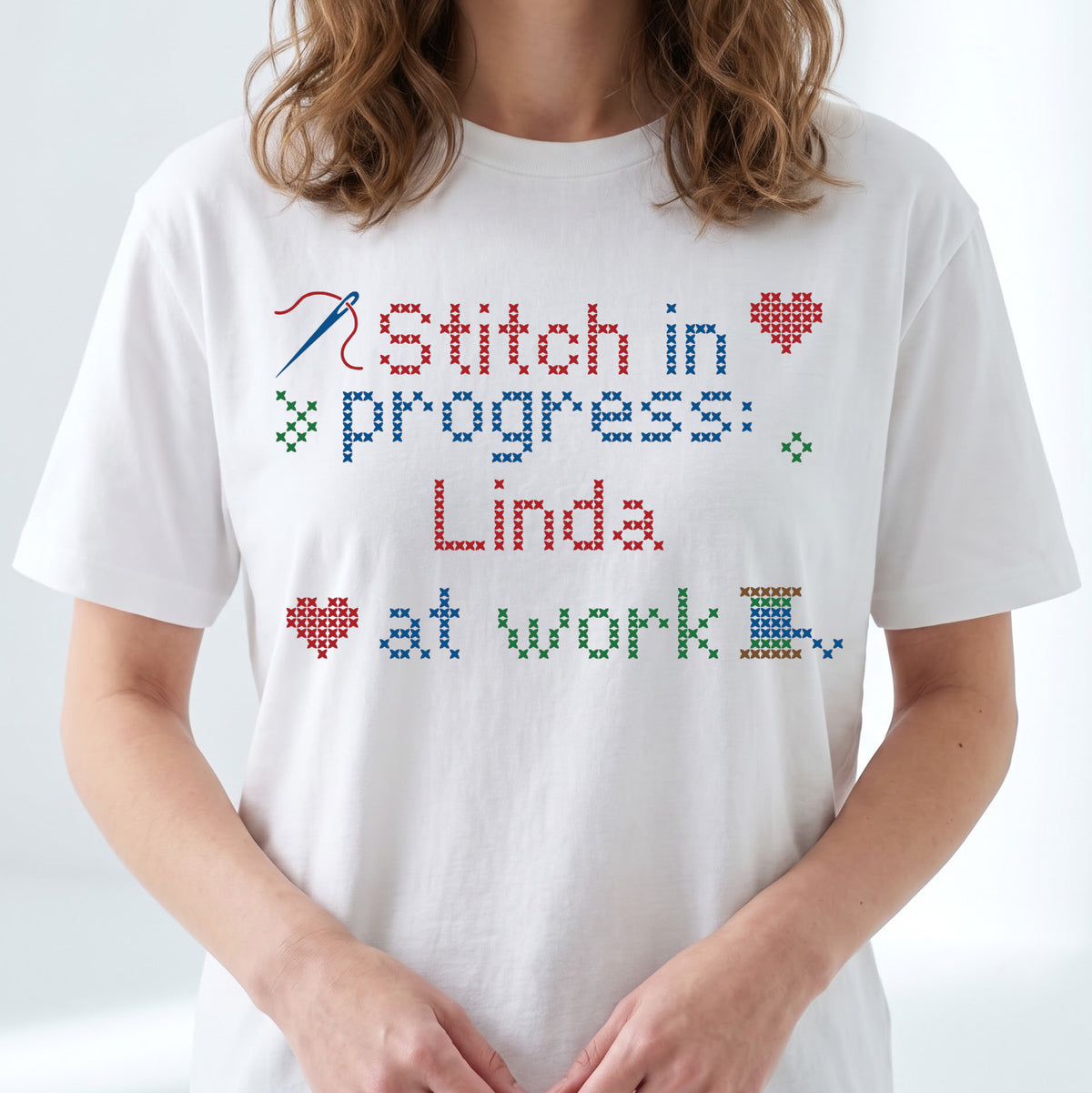 "Stitch in progress: [Name] at work" - Faux Cross Stitch T-Shirt | Custom Name
