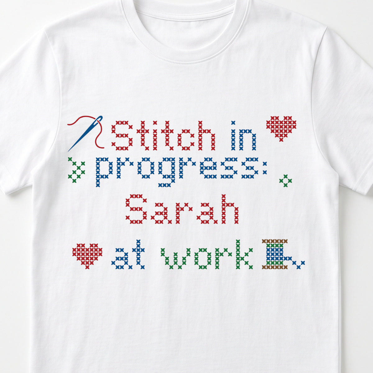 "Stitch in progress: [Name] at work" - Faux Cross Stitch T-Shirt | Custom Name