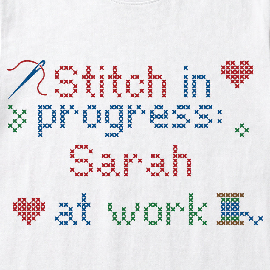 "Stitch in progress: [Name] at work" - Faux Cross Stitch T-Shirt | Custom Name